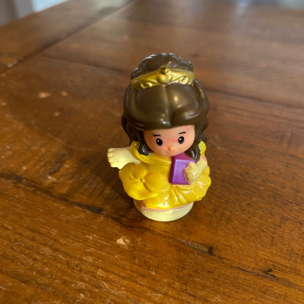 Fisher Price Little People Belle with purple book as is. Has marker on her face